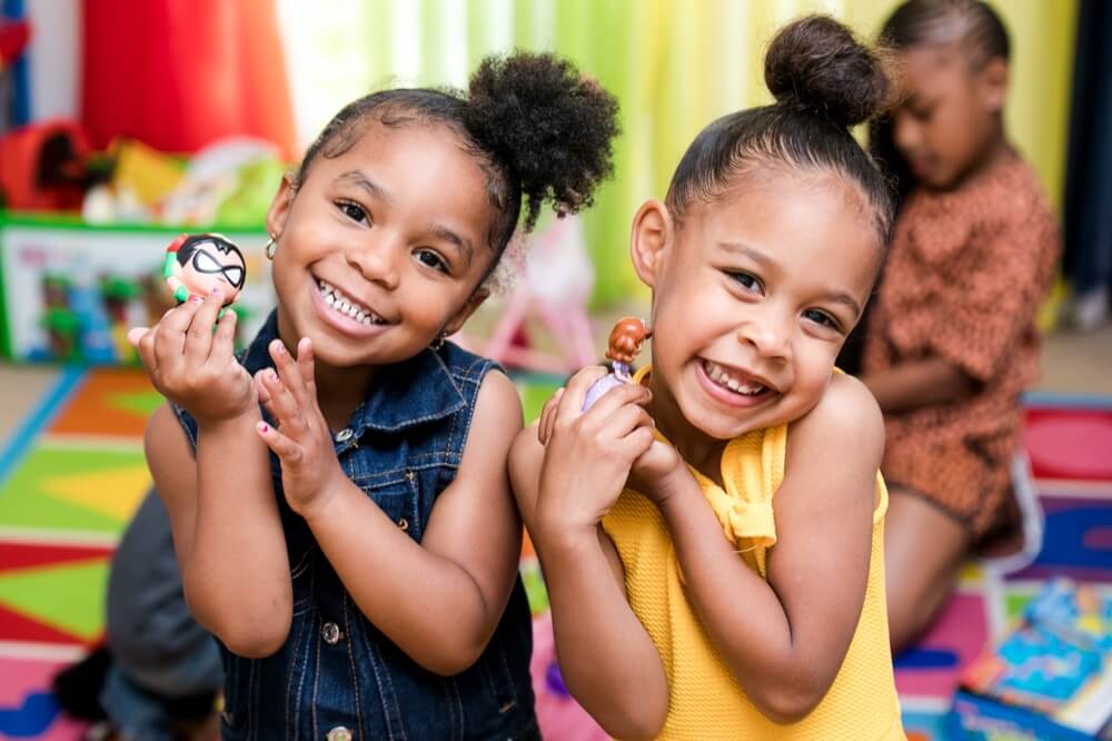 Two children smiling and playing together